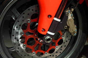 Motorcycle wheel fragment with red parts