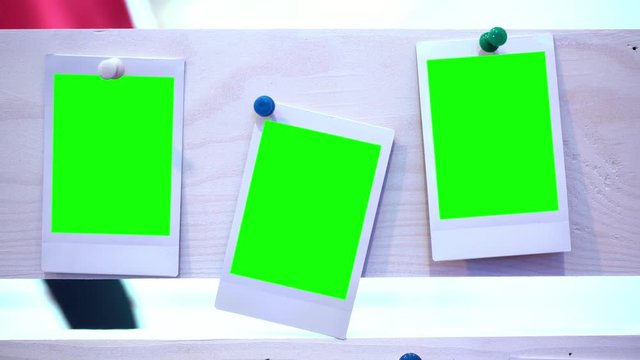 The photo. Photo frame with green background. Hromakey. Green screen. Photos attached to wooden boards. Memory. Story. Family photos. A party