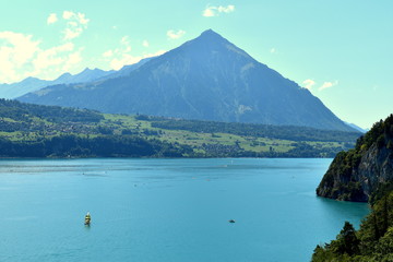 Lake Thun of Switzerland and mountains in background in a very nice and sunny summer day