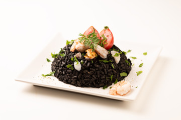 Black rice with cuttlefish on white