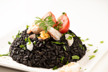Black rice with cuttlefish on white