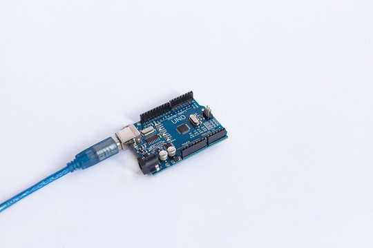 TERNOPIL, UKRAINE - APRIL 19, 2019: Arduino Uno. Micro controller. Technology. Development platform connected to PC with a USB cable. Electronic computing machine. Concept. High intelligence.