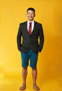 Guy with coat and beach shorts
