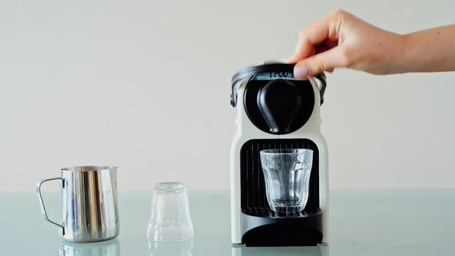 putting refillable pod into coffee machine