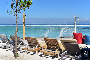 Sun loungers or deckchairs on a sandy beach with ocean view, Gili Trawangan Island, Indonesia