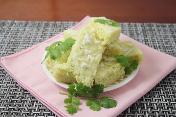 Indian gujarati Traditional  Food  Dhokla snack made from rice chick pea flour and rava 