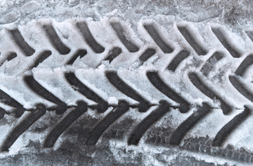 Imprint tractor tires on the snow.View from above.