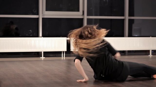 Amazing emotional dancing performance of graceful girl. She is moving her body