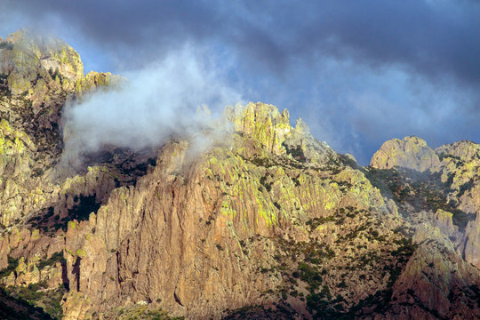 Colorful rock walls of Arizona's Chiricahua Mountains as a thunderstorm moves in