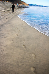 Trail of footprints along the coast