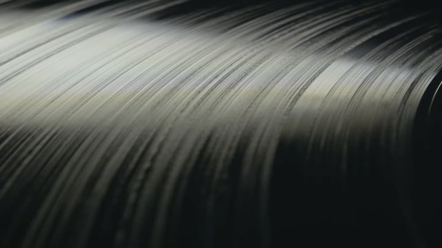 Modern vinyl record plate spinning on a turntable, seamless loop footage