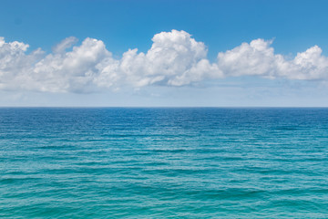 Fototapeta na wymiar tropical summer ocean beach and clouds texture background 
