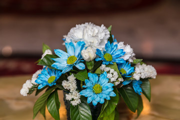 bouquet of flowers in a vase on wooden table