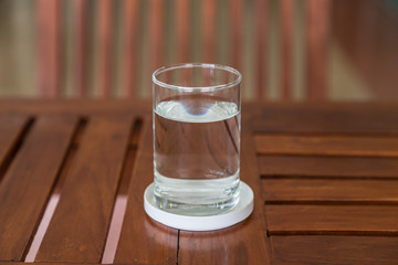 glass of water on wooden table