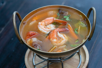 Tom yam kung or Tom yum, Tom yam is a spicy clear soup typical in Thailand. Popular food in Thailand