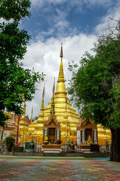 Image of golden pagoda is located in the temple in bantak District. Buddhist temple in Thailand.
