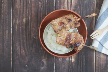 Grilled pork with sticky rice on bowl