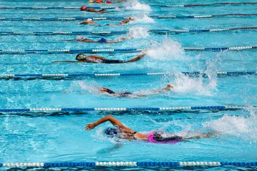 Fotobehang Athletes competing in the swimming pool. © MrPreecha
