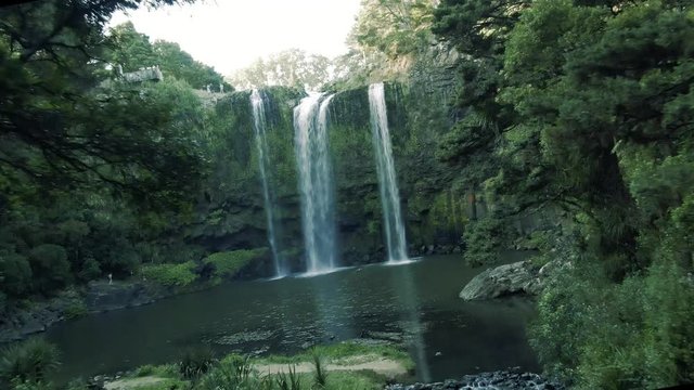 Whangarei Waterfalls aerial drone footage flying through trees 4k dramatic  footage in New Zealand with circular motion