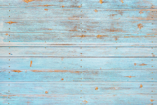 Vintage beach wood background - Old weathered wooden plank painted in turquoise or blue sea color.