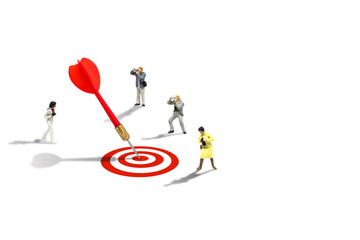 Marketing Concept : Miniature figurine character as photographers taking photograph red dart hit target on dartboard isolated on white background.