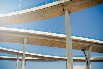 Architecture Bridge of Industrial Rings or Bhumibol Bridge is concrete highway road junction and interchange overpass and cross the Chao Phraya River, Thailand.