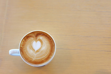 hot latte coffee drink put on wooden table in cafe restaurant