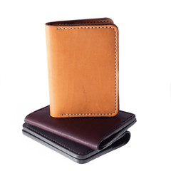 Leather accessories on a white background, wallets, coin boxes and straps, isolated