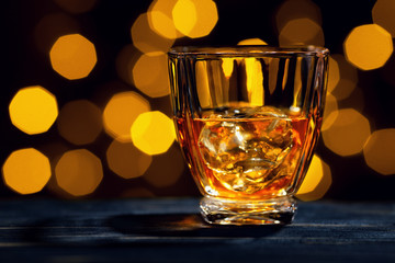 whiskey with ice cubes in glass