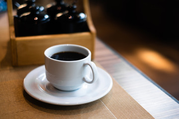 Cup of hot coffee on dinning table in restaurant for breakfast.