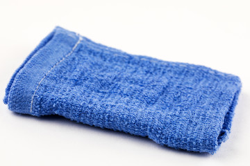 Clean blue kitchen towel on white background.