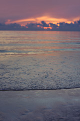 Blur beach with sunrise background.