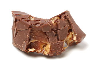 Chocolate peanut candy on white background