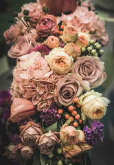 Flower arrangement of different colors. The photo is processed in vintage style, toning and light...