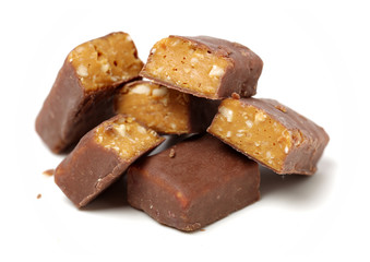 Chocolate peanut candy on white background