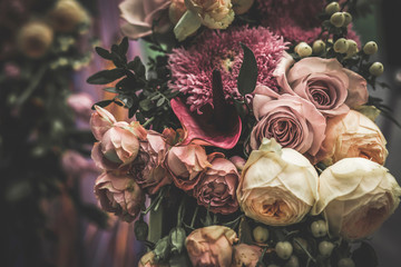 Flower arrangement of different colors. The photo is processed in vintage style, toning and light...