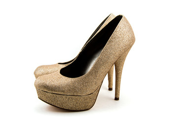 An isolated pair of Gold Stiletto Heals
