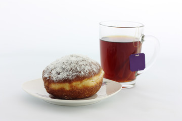 cup of tea and donut on white background