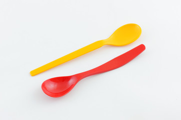 Two plastic baby spoons