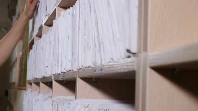 Medical records in archives. catalog in clinic. Healthcare clinic. Oldfashioned medical cards on shelves in hospital. 4k