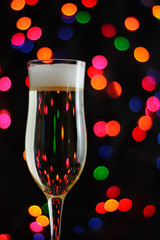 glasses of champagne on background of lights