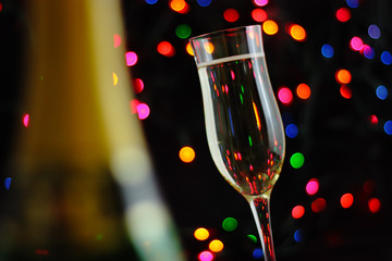 glasses of champagne on background of lights