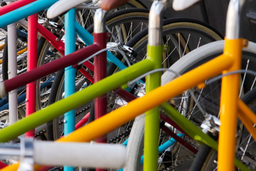 Rack of colored bicyles, reflecting new yorkers desire for healthy and eco-friendly urban...