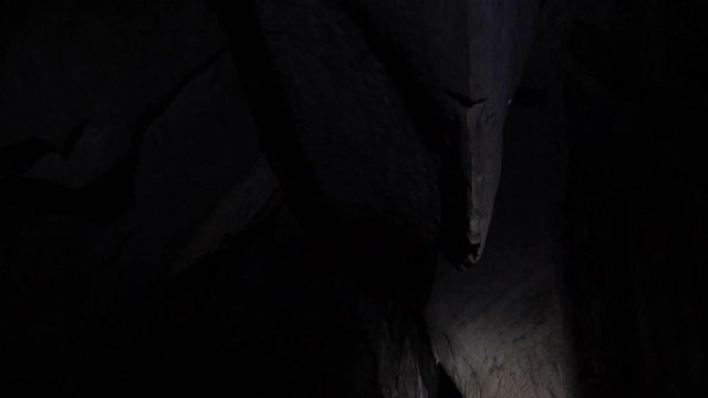 Floating inside Underground river by boat, Sabang, Philippines. Dark lighting with the real feeling from visitor's point of view. Wonder of the World.