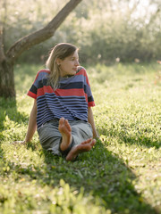 Fototapeta premium Young woman relaxing at garden