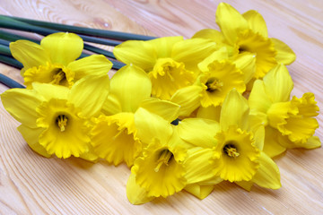 Yellow daffodils on a wooden table, Easter bouquet