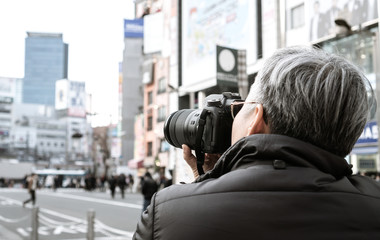 Adult people photographer journalist travelers take photo billboard building or businesson shopping...