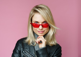 Image of blonde in pink glasses in leather jacket