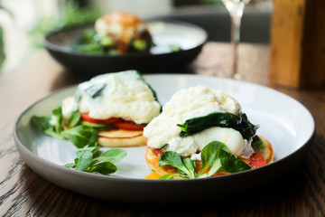 Pancakes with poached egg, cheese and spinach