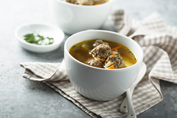 Homemade soup with meatballs